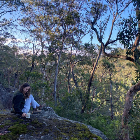 Ariel sitting on rock