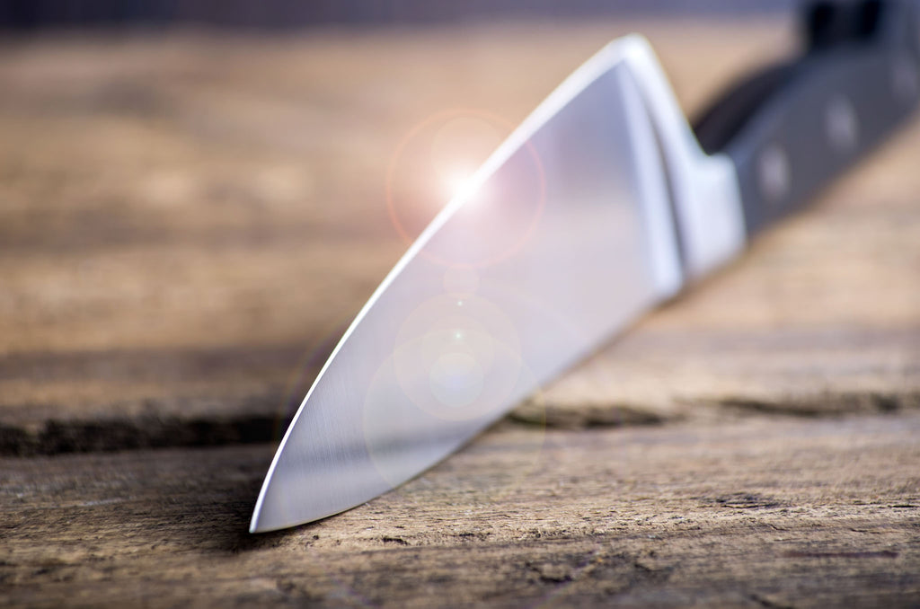 Sharp kitchen knife with shiny blade edge