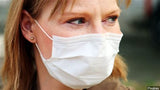 woman wearing surgical mask