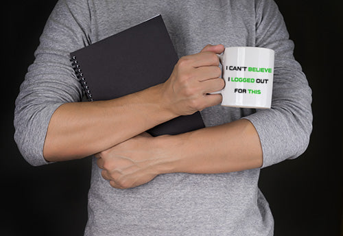 Man holding a mug for gamers