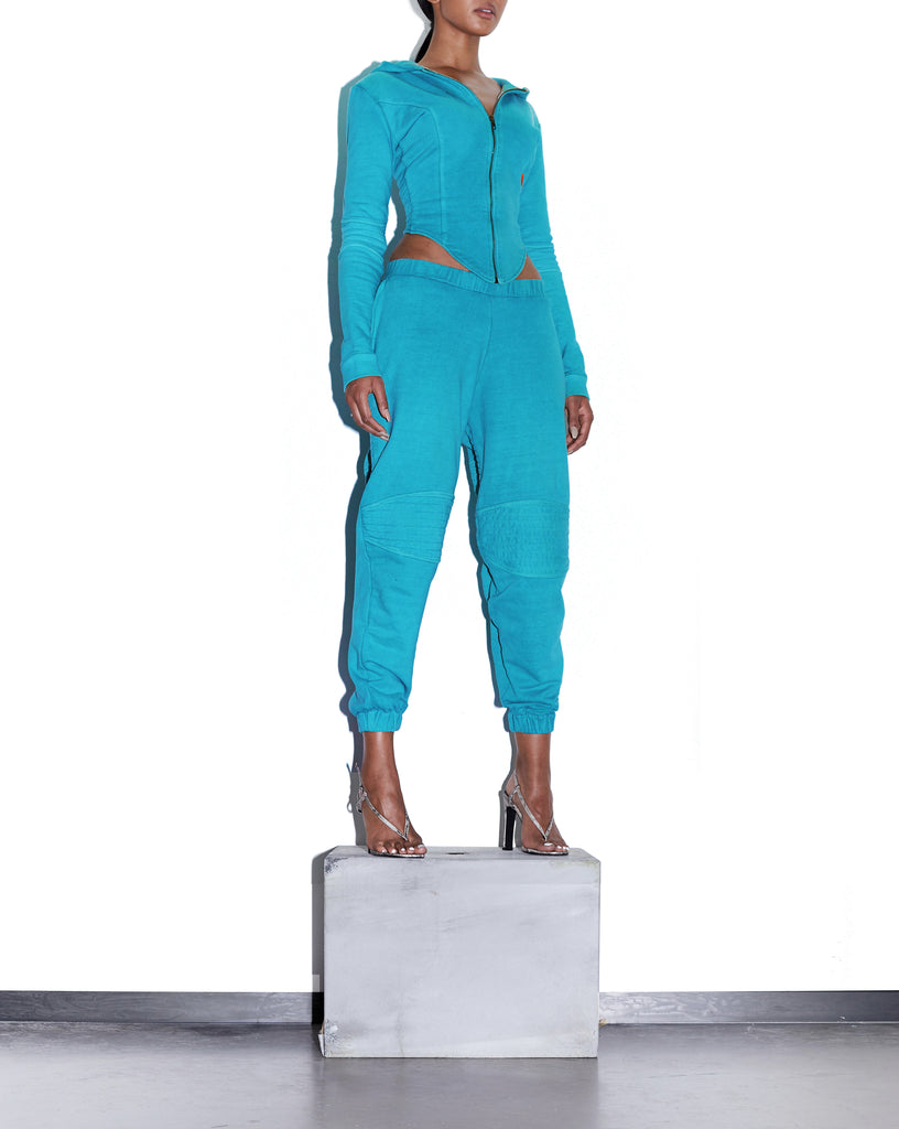 Model wears SIZE X-SMALL TONIK Slouch Panelled Joggers in Azure Blue by TheKLabel