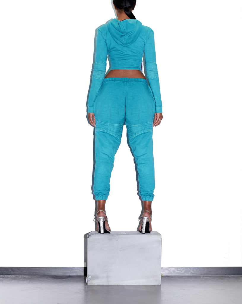 Model wears SIZE SMALL TONIK Corset Hoodie in Azure Blue by TheKLabel