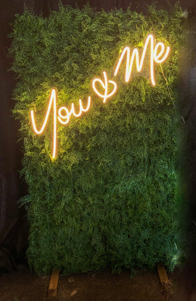 You & Me neon on greenery backdrop | Party decorations hire – Rock the Day