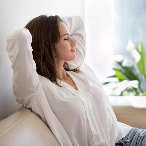 image of woman relaxing after using the zenbud device